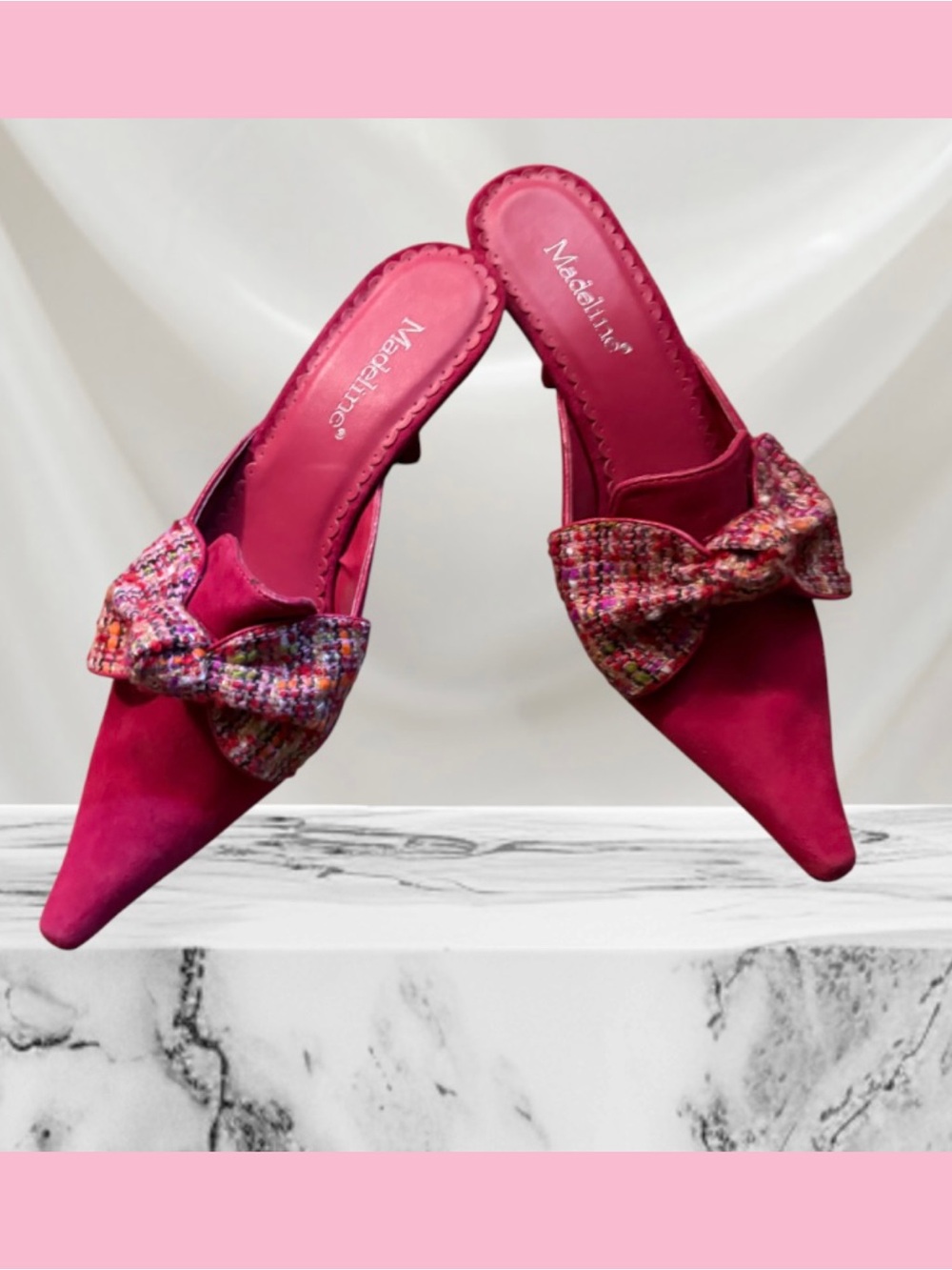 Sophisticated Leather hot pink heels with a tweeted bow. Kitty heel.